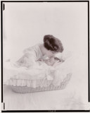 Young woman kissing baby in bassinet by rvdb, photography->manipulation gallery